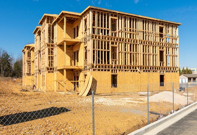 a snapshot of temporary chain link fences protecting a large construction project from unauthorized access in Coolidge